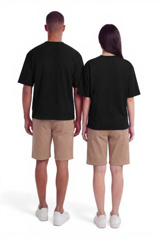 Two people wearing black t-shirts and beige shorts on a white background